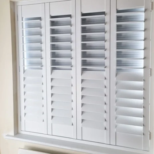 narrow panelled blackout shutters on sash windows