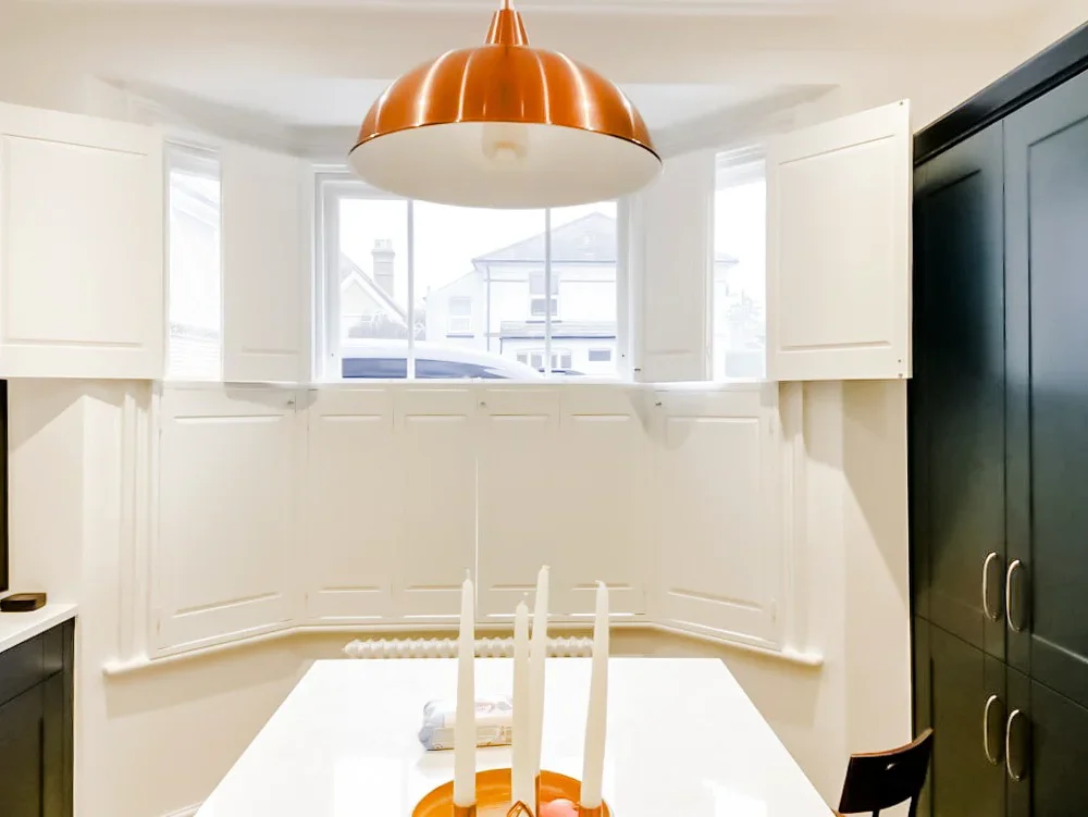 Tier on tier solid panel shutters in kitchen